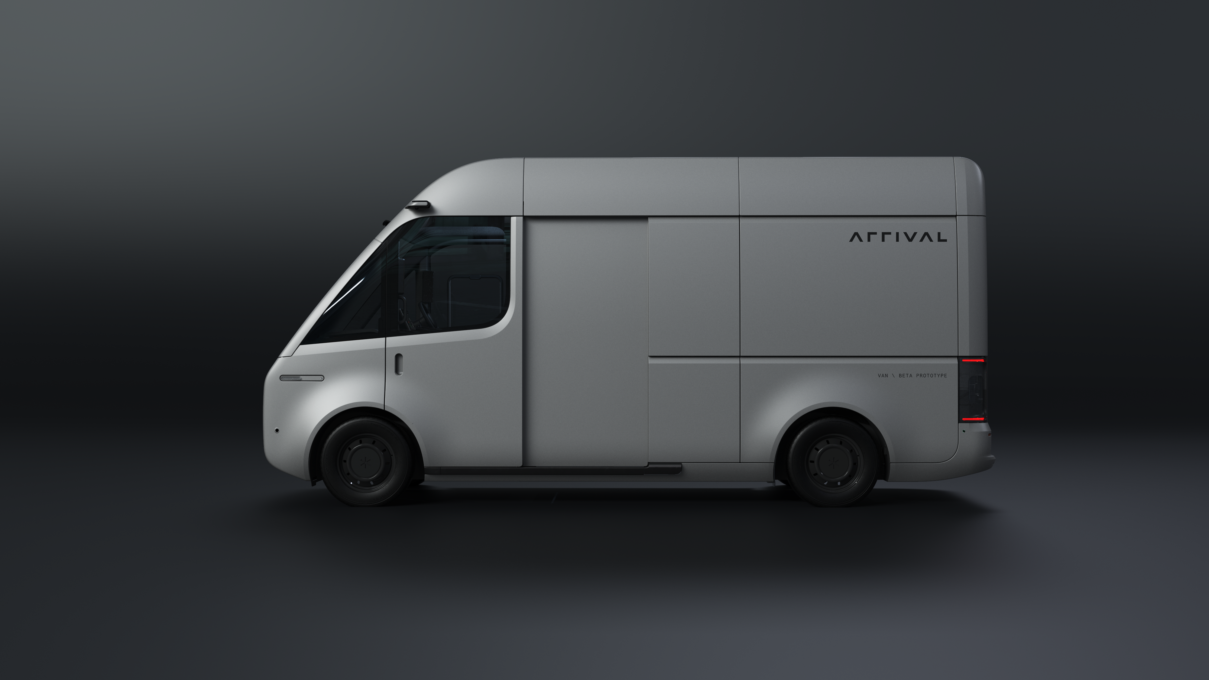 Side view of a silver Arrival beta-prototype delivery van